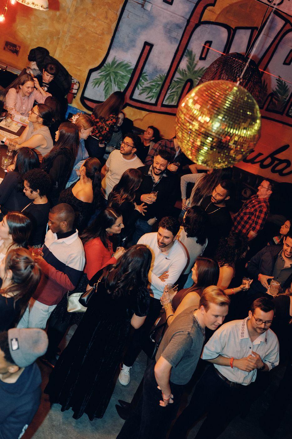 A packed Peared party under a disco ball