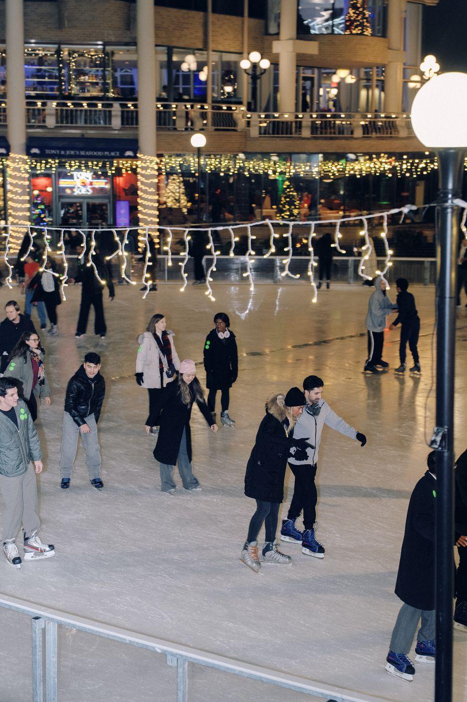 Guests skating at a holiday ice rink