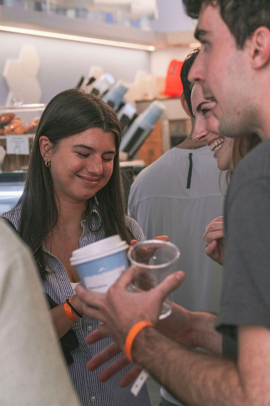 Guests chatting over coffee at a Peared event