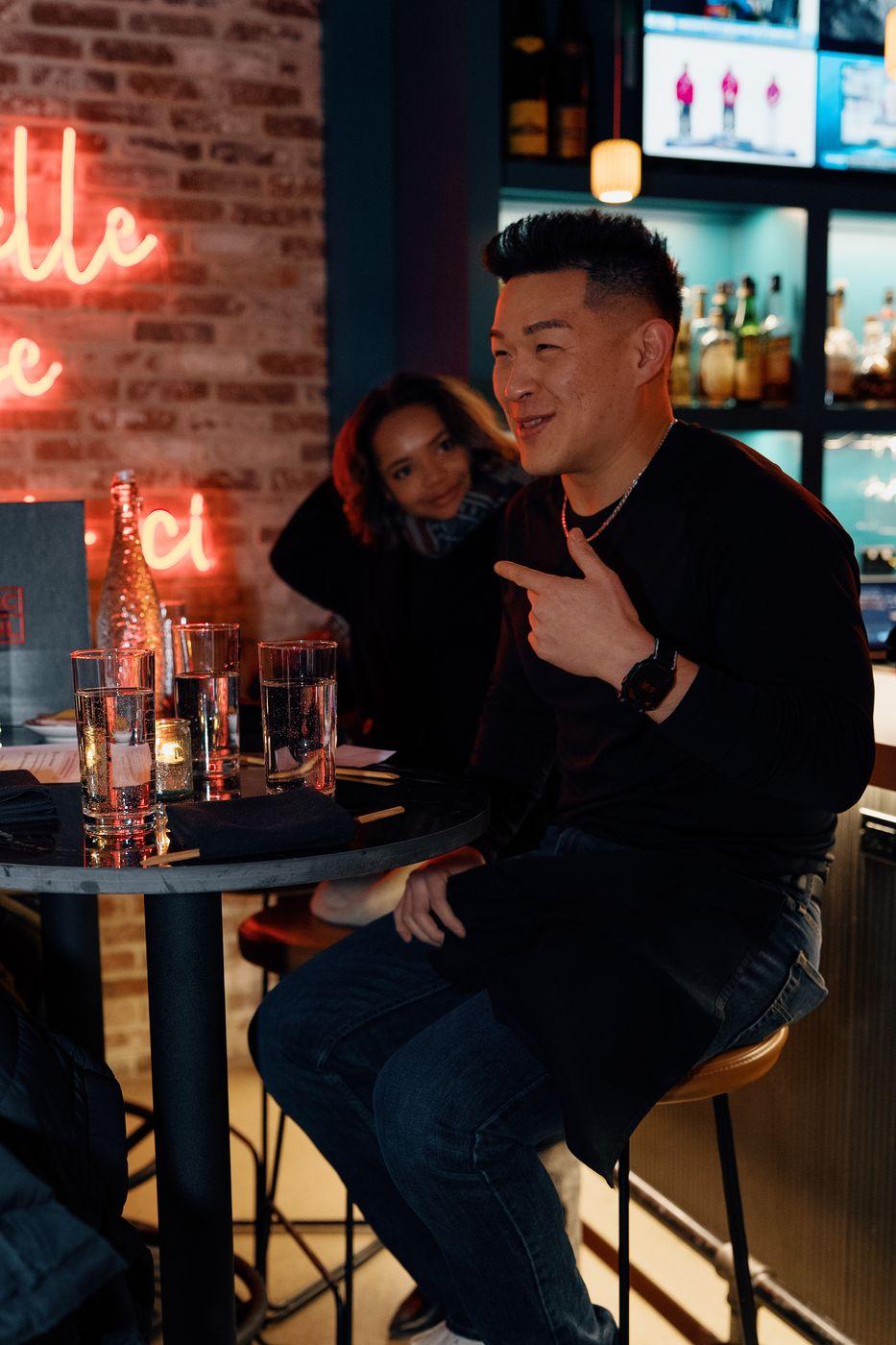 Guests talking at a bar event