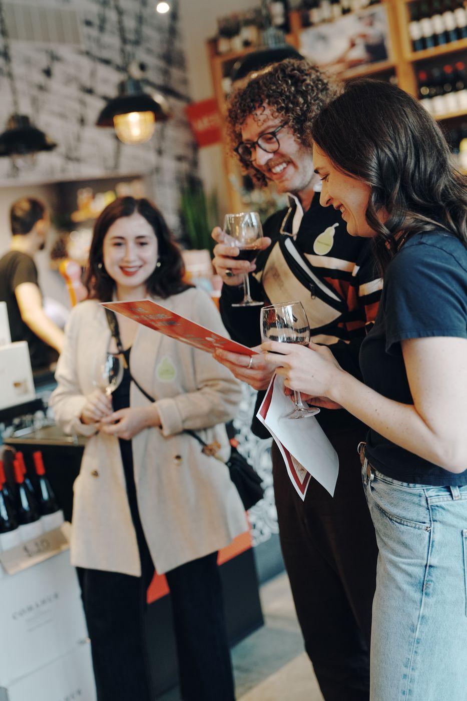 Guests comparing notes at a wine tasting